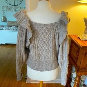 Cable knit wool ruffle sleeve sweater